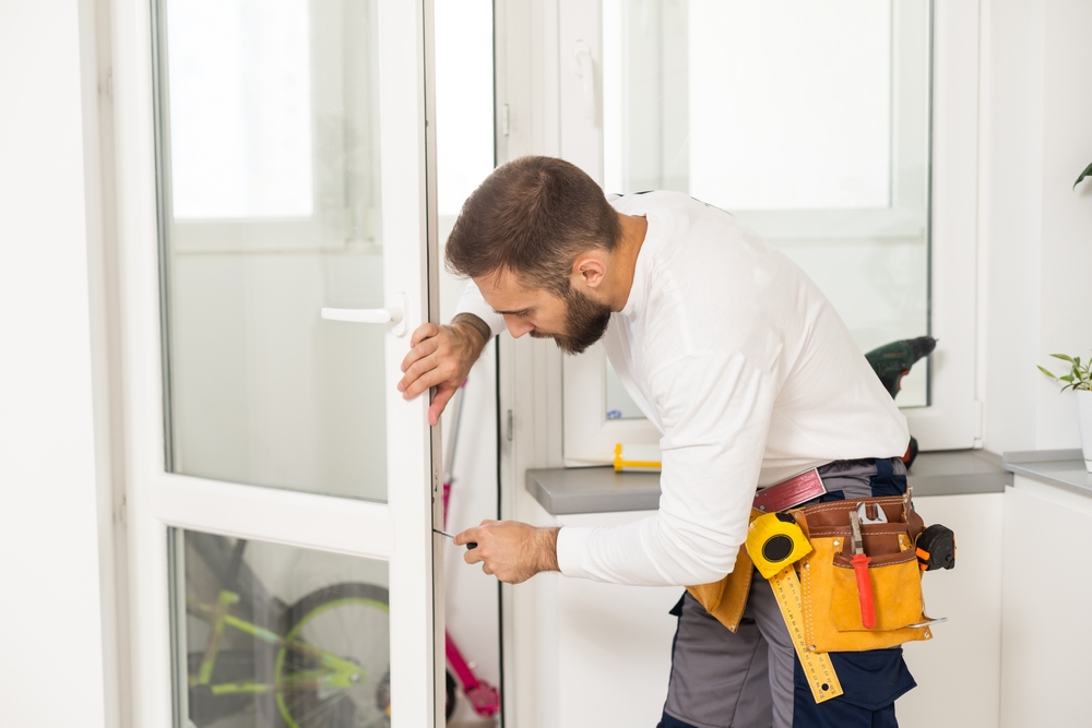 Contractor replacing interior or exterior doors in a residential home