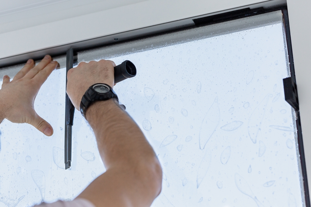 Modern tinted glass windows installed in a desert home to reduce glare and solar heat gain